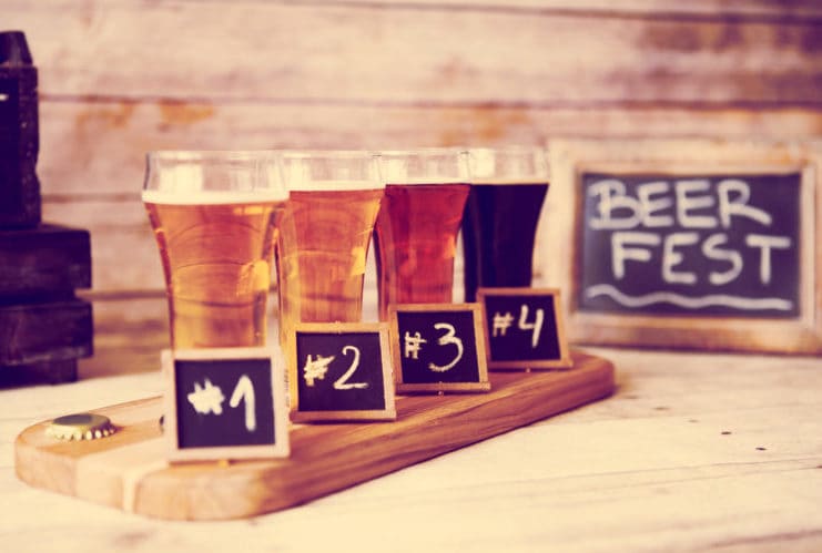 A spread of drinks and small plates set out for tasting